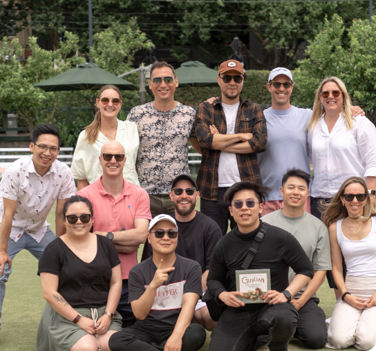 Sonar team christmas party photo in a grass field background