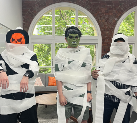 Sonar haloween party event and a picture of 3 staffs wrapped in a tissue rolls.