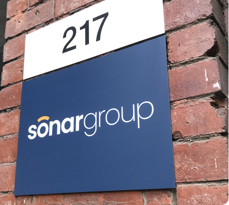Sonar Group signage board attached to a brick wall in Queen Street, Melbourne Victoria